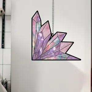 Detailed view of a beautiful purple crystal cluster window hanging with metal chain in room.