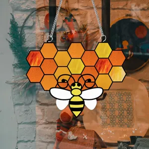 Stained acrylic honeycomb bee hanging plaque detail, vintage window decor with metal chain.