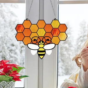 Detailed view of the stained acrylic honeycomb and bee window hanging, perfect for home decor.