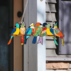 Close-up of colorful stained glass style acrylic bird hanging ornament on porch detail.
