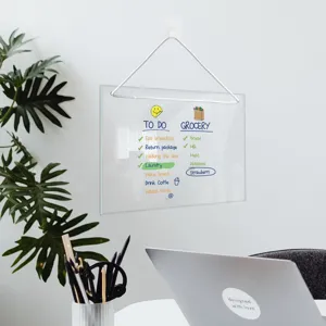 Clear acrylic hanging dry erase board detail view showing daily to do list and grocery planner.