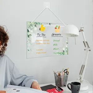 Clear acrylic hanging memo board with weekly planner design for office and home wall organization.