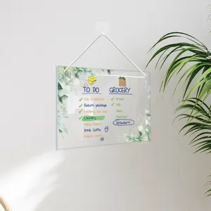 Clear acrylic hanging memo board with watercolor green leaf design for daily planning and notes.