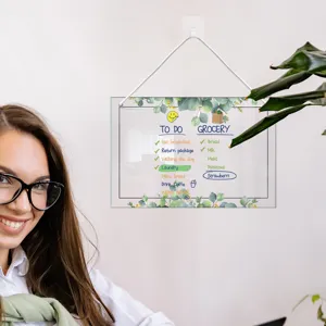 Clear acrylic hanging dry erase board detail showing weekly to do list and grocery notes.