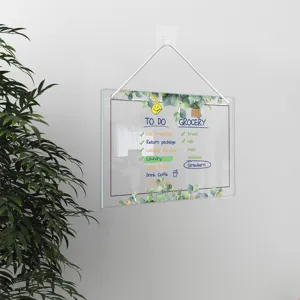 Clear acrylic hanging memo board with weekly checklist and elegant eucalyptus leaf design.