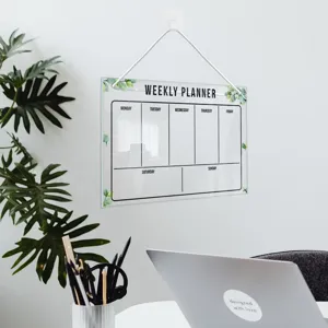 Hanging acrylic weekly planner board with dry erase calendar design for home office use.