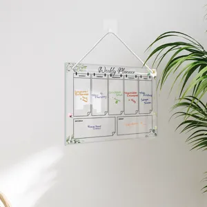 Hanging acrylic weekly planner board with plant decor, reusable dry erase calendar memo.