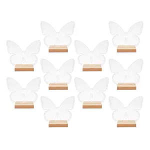 Números de mesa de mariposa de acrílico transparente con base de madera para bodas.