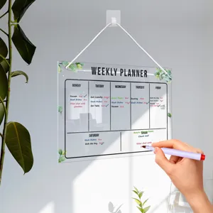 Clear acrylic weekly planner board with hanging rope for wall organization and daily office notes.
