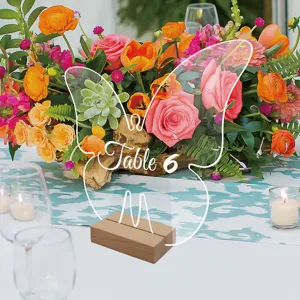 Clear acrylic butterfly table number sign with wood base for wedding party decor.