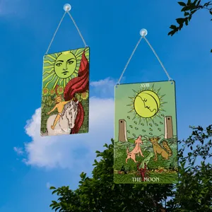 Tarot card window hanging metal plaque detail, featuring sun and moon tarot art design.