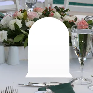 Close-up detail of clear arch acrylic sign for wedding table number decor and DIY display.