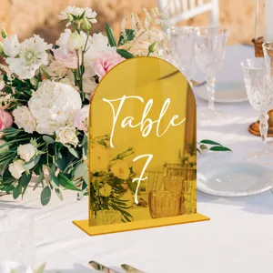 Gold mirror acrylic table number sign detail view for wedding decoration table setup display.