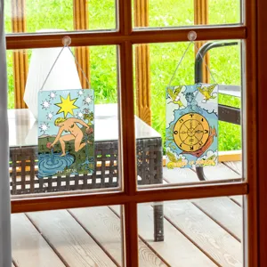 Detailed view of tarot card window hanging suncatcher featuring The Star and Wheel of Fortune.