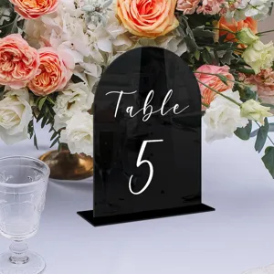 Black arched acrylic table number sign detail, elegant wedding decor desk display stand.