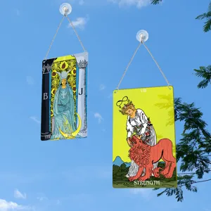 Tarot card window hanging decor featuring The High Priestess and Strength designs.