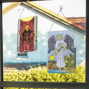 Tarot card window hanging detail, metal sign decor close up showing Justice and Temperance art.