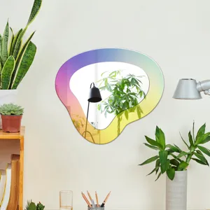 Détail de l'autocollant mural miroir acrylique dégradé irrégulier pour une déco moderne.