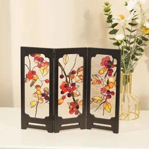 Detail view of the 3-panel tabletop folding screen with stained glass autumn leaves.