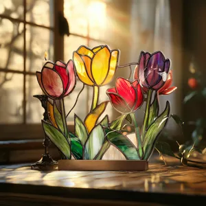 Stained acrylic tulip table ornament detail view, glowing floral decor for home interior.
