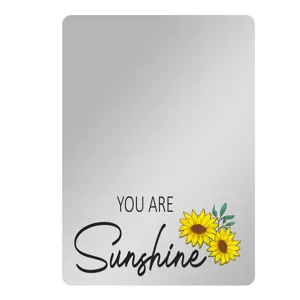 Vista detallada del espejo magnético para taquilla con un hermoso diseño de girasol.