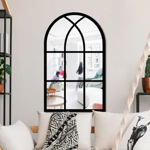 Arch window mirror with black grid frame, elegant wall decor for living room interior design.