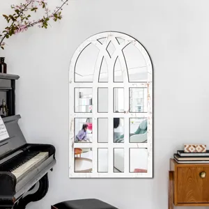 Arch window decorative wall mirror detail showing rustic white frame in a cozy home setting.