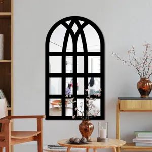 Arched window decorative wall mirror detail showcasing black frame and clear acrylic reflection.