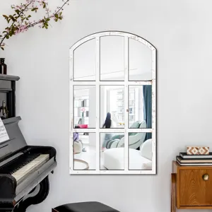 Arched wall mirror detail, rustic white distressed window pane design in living room.
