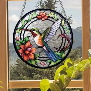 Detailed close-up of the stained glass hummingbird suncatcher hanging by the window.