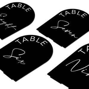 Black acrylic arched wedding table number signs, modern DIY table place cards for party decor.