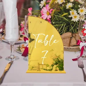 Close-up detail of the modern acrylic table number sign placed on a banquet table.