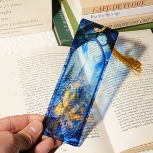Detailed view of the transparent acrylic bookmark featuring a fantasy stained glass art design.