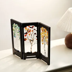 Vintage tabletop miniature folding screen with stained glass trees design, wooden decor.