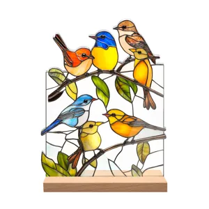 Stained glass acrylic bird ornament detail, colorful desktop decor on a natural wooden base.
