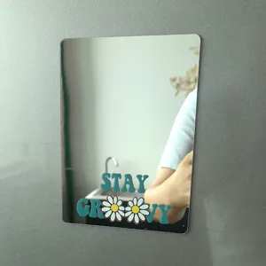 Vista detallada del espejo magnético para taquilla con diseño de flores retro.