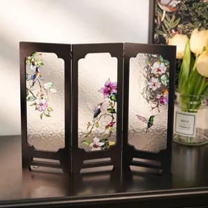 Detailed view of the vintage embossed glass screen desktop ornament with floral design.