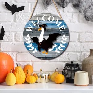 Detailed view of a Halloween wooden hanging sign with a cute bat goose and welcome text.