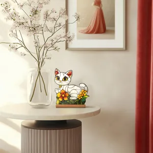 Stained glass style white cat acrylic desktop ornament details with floral base in home setting.
