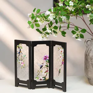 Detailed shot of vintage faux relief glass folding screen tabletop ornament with hummingbird floral art.