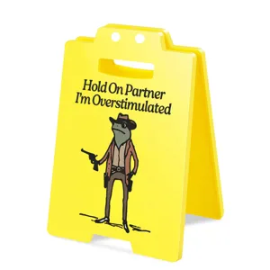 Funny frog cowboy yellow warning sign detail shot, acrylic office desk prank decor item.
