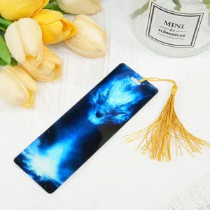 Acrylic dragon bookmark with golden tassel, detailed view of student stationery and craft.