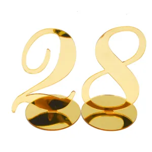 Gold acrylic table numbers 28 for wedding reception restaurant decor event table settings.
