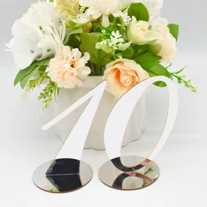 Acrylic table number sign with reflective surface for wedding, restaurant, and party decoration detail.