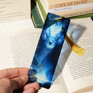 Translucent blue acrylic dragon pattern bookmark with gold tassel for book reading