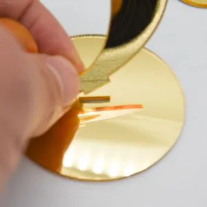 Gold mirror acrylic table number sign detail view, showing easy assembly for wedding restaurants.