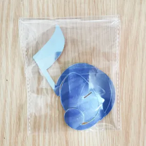 Blue acrylic musical note table number card detail shot for wedding party decor.