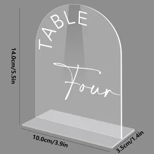 Detail view of clear acrylic arch table number sign with custom text and stable base stand.