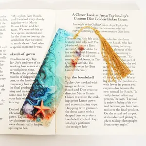Acrylic ocean theme bookmark with gold tassel, translucent design for reading and gifts.