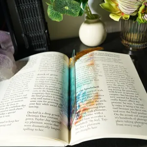 Creative colorful light-transmitting acrylic bookmark with tassel for reading lovers.